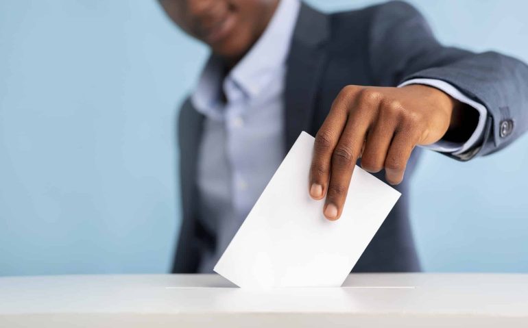 African man voted on president elections, blurred background